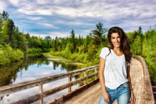 Load image into Gallery viewer, Blown Away shirt on model by the river